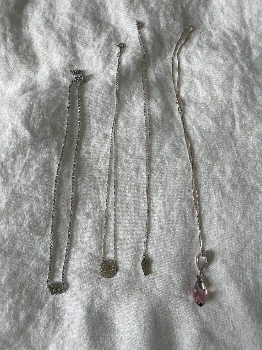 Four Silver Tone Necklaces